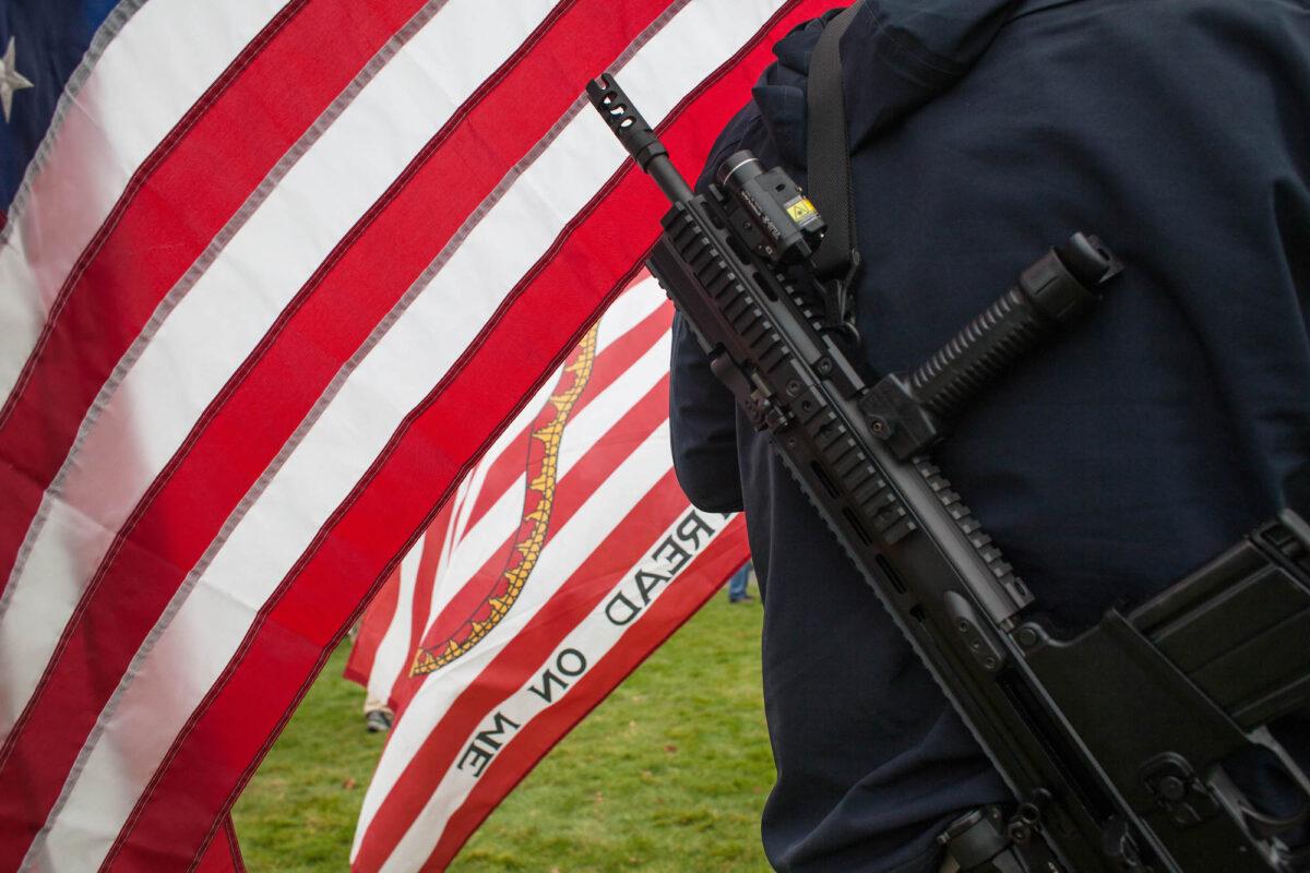 A demonstrator carries a rifle during a pro-gun rally on Jan. 19, 2013, in Olympia, Washington. (David Ryder/Getty Images)