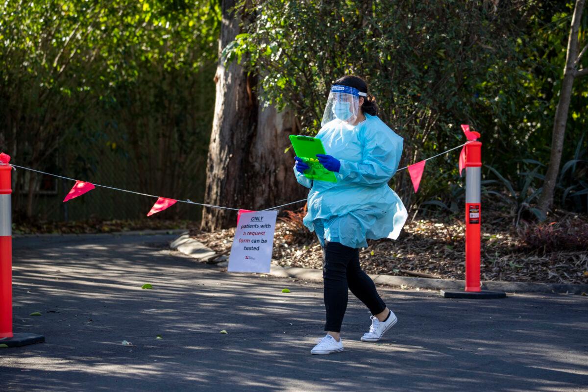 Nurses are seen doing COVID-19 testing at a drive-thru fever clinic in Ipswich in Brisbane, Australia, on Aug. 24, 2020. (Glenn Hunt/Getty Images)