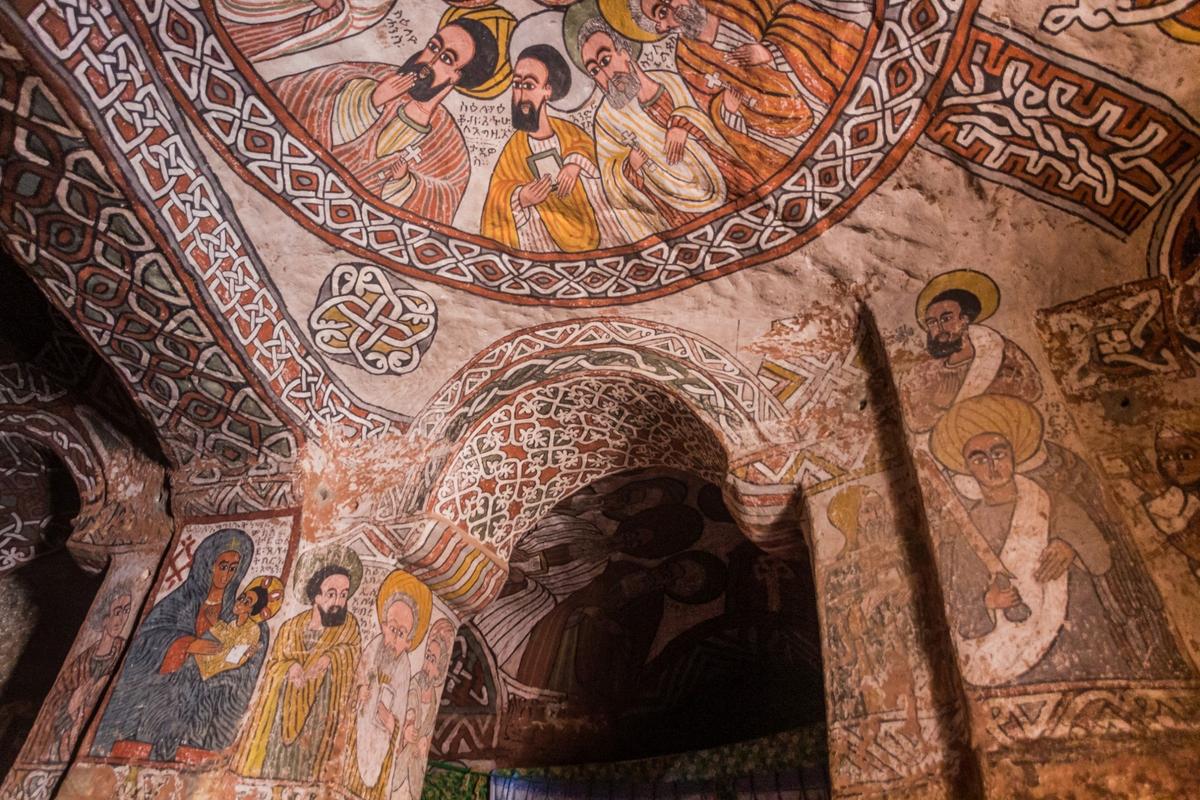 Tempera-based paintings from the 15th or 16th centuries depict angels and apostles on plaster on the walls of the church. (Matyas Rehak/Shutterstock)
