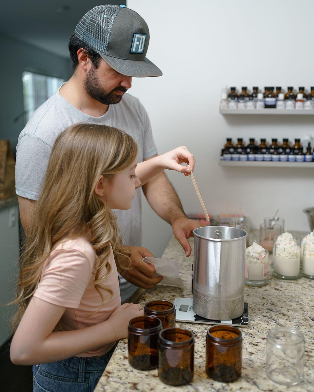 Lily and her dad, Sergio Moreno, making the candles. (Courtesy of <a href="https://www.instagram.com/lilylousaromas/">Lily Lou’s Aromas</a>)