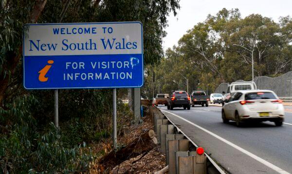 Cars from Victoria enter the southern New South Wales (NSW) border city of Albury, in Victoria, Australia, on July 7, 2020. (William West/AFP via Getty Images)