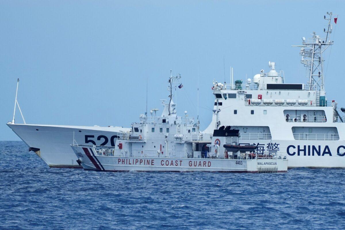 A Chinese Coast Guard ship with bow number 5201 blocks a Philippine coast guard ship as it maneuvers to enter the mouth of the Second Thomas Shoal, locally known as Ayungin Shoal, in the South China Sea on April 23, 2023. (Aaron Favila/AP Photo)