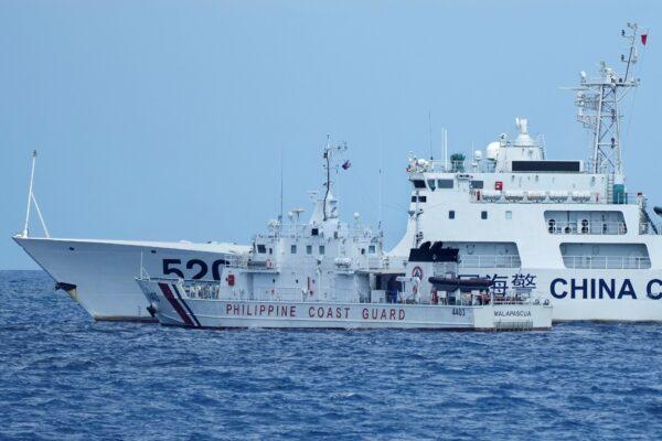 A Chinese Coast Guard ship with bow number 5201 blocks Philippine Coast Guard ship BRP Malapascua as it maneuvers to enter the mouth of the Second Thomas Shoal, locally known as Ayungin Shoal, at the South China Sea on April 23, 2023. (Aaron Favila/AP Photo)