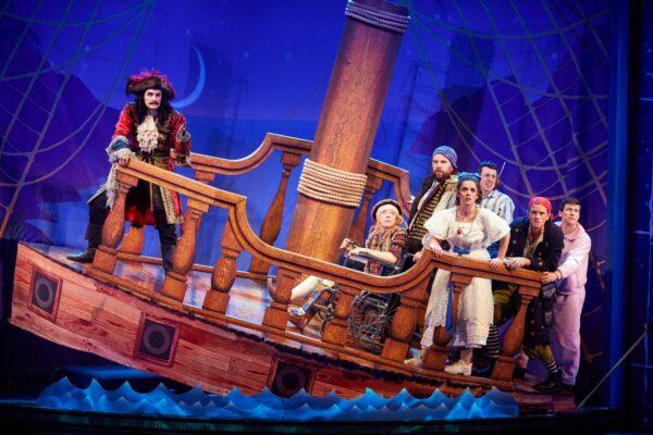 (L–R) Chris (Henry Shields), Lucy (Ellie Morris), Robert (Henry Lewis), Sandra (Charlie Russell), Dennis (Jonathan Sayer), Francis (Neil Patrick Harris), and Max (Matthew Cavendish), in “Peter Pan Goes Wrong.” (Jeremy Daniel)