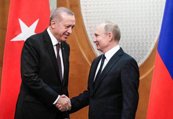 Russian President Vladimir Putin (R) meets with his Turkish counterpart Recep Tayyip Erdogan in the Black Sea resort of Sochi on Feb. 14, 2019.  (Sergei Chirikov/AFP via Getty Images)
