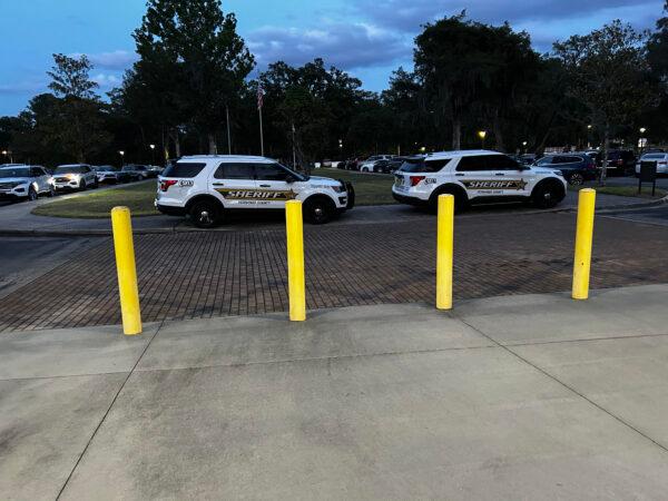 Vehicles from the Hernando County Sheriff's Department parked in front of the Hernando County Public School District building for the County School Board meeting, on April 25, 2023. (Patricia Tolson/The Epoch Times)