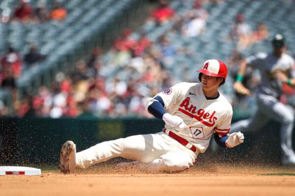 Shohei Ohtani (17) of the Los Angeles Angels slides into second base during the third inning against the Oakland Athletics at Angel Stadium of Anaheim in Anaheim, Calif., on April 27, 2023. (Meg Oliphant/Getty Images)