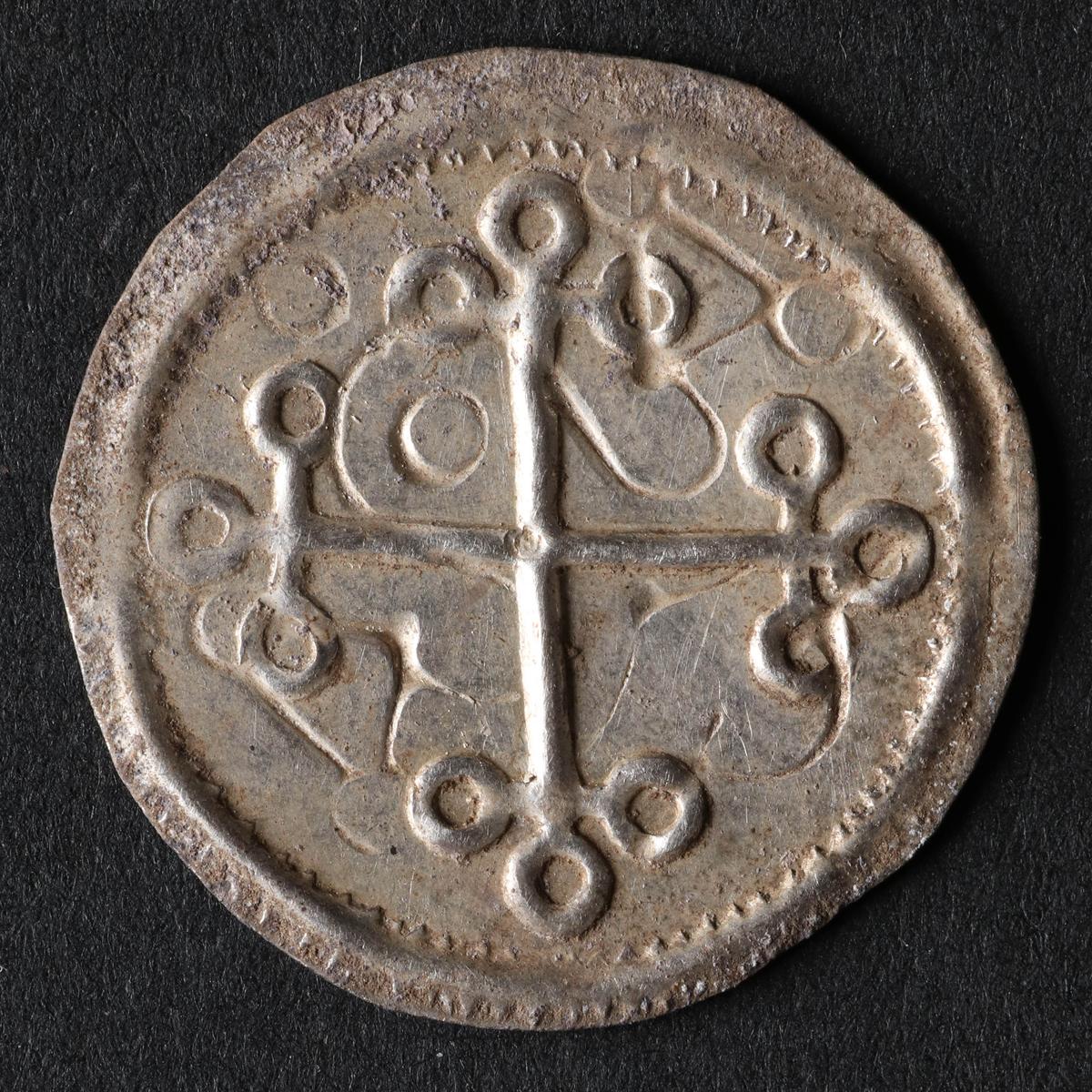 A well-preserved cross-bearing coin struck under Harald Blåtand at the end of the 10th century. (Photos from Nordjyske Museer, Denmark)