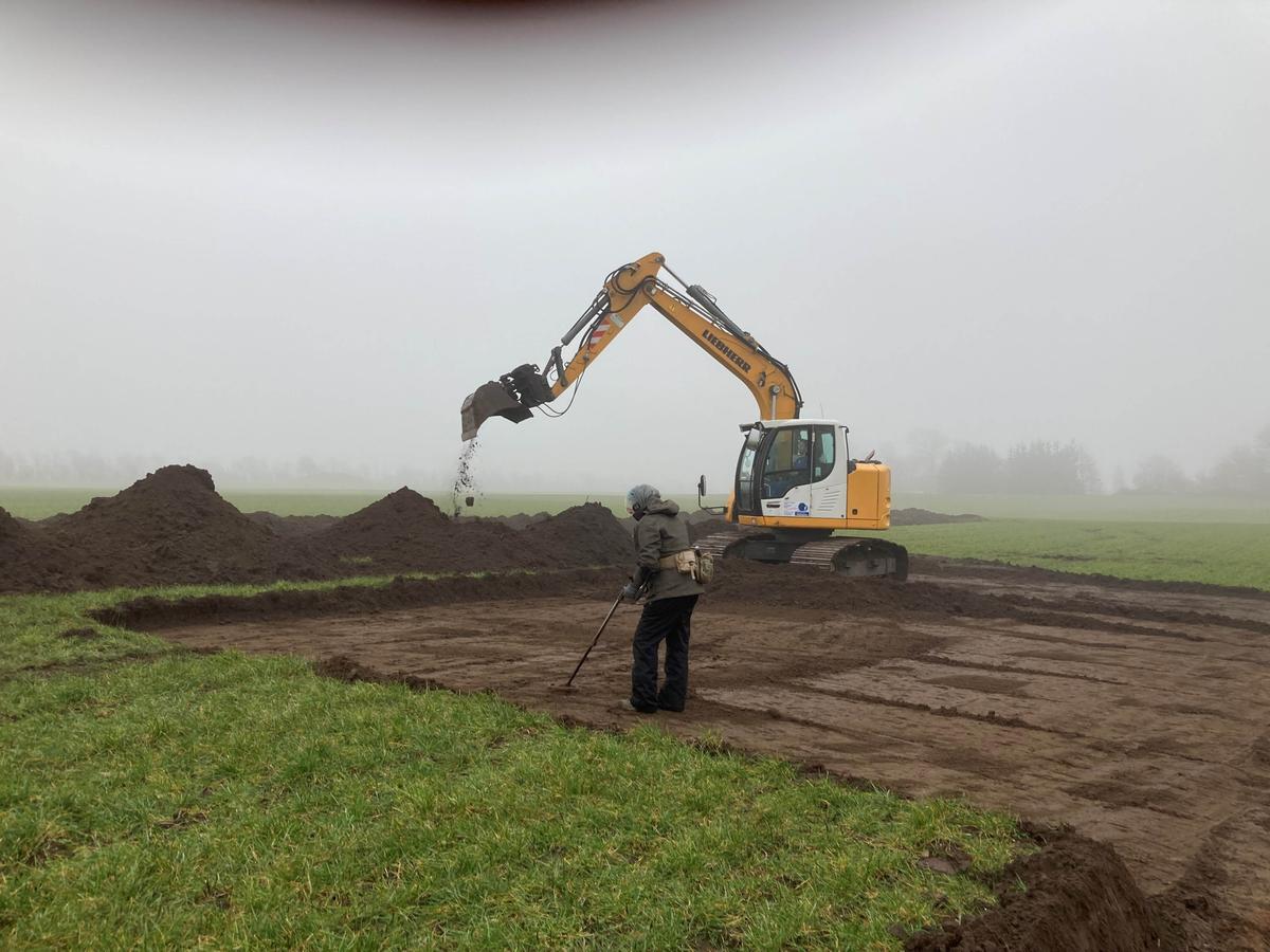 An excavator and researchers work on digging and searching for Viking-era artifacts in a field in Blåtand, Denmark. (Photos from Nordjyske Museer, Denmark)