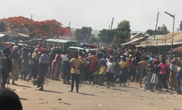Citizens in Jos South, Nigeria, force police vehicles to pull back during a protest on April 26, 2023. (Photo by Masara Kim)