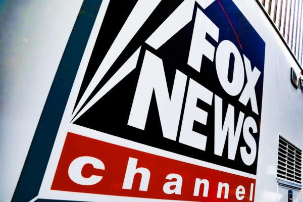 A Fox News channel sign is on a television vehicle outside the News Corporation building in New York City, on Nov. 8, 2017. (Shannon Stapleton/Reuters)