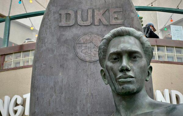 A staue of Duke Kahanamoku sits on the Surfing Hall of Fame in Huntington Beach, Calif., on April 27, 2023. (John Fredricks/The Epoch Times)