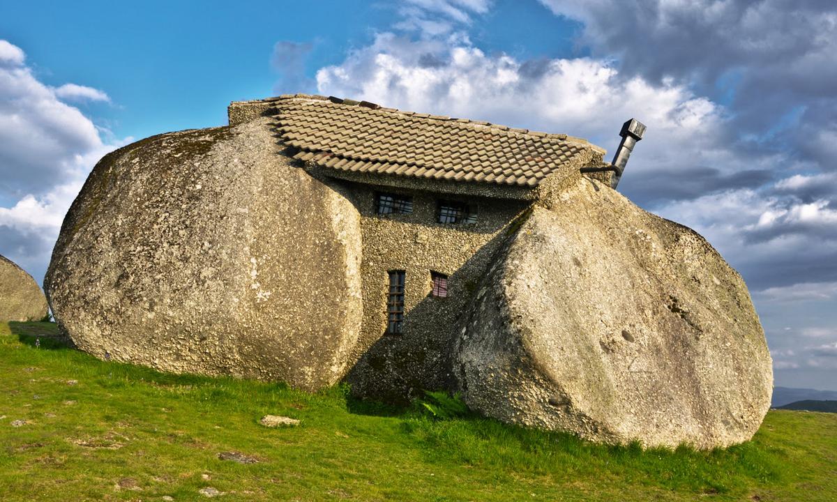 The Real-Life Flintstones Home: Bizarre ‘Stone House’ Built From Boulders Has Bulletproof Windows—but No Electricity