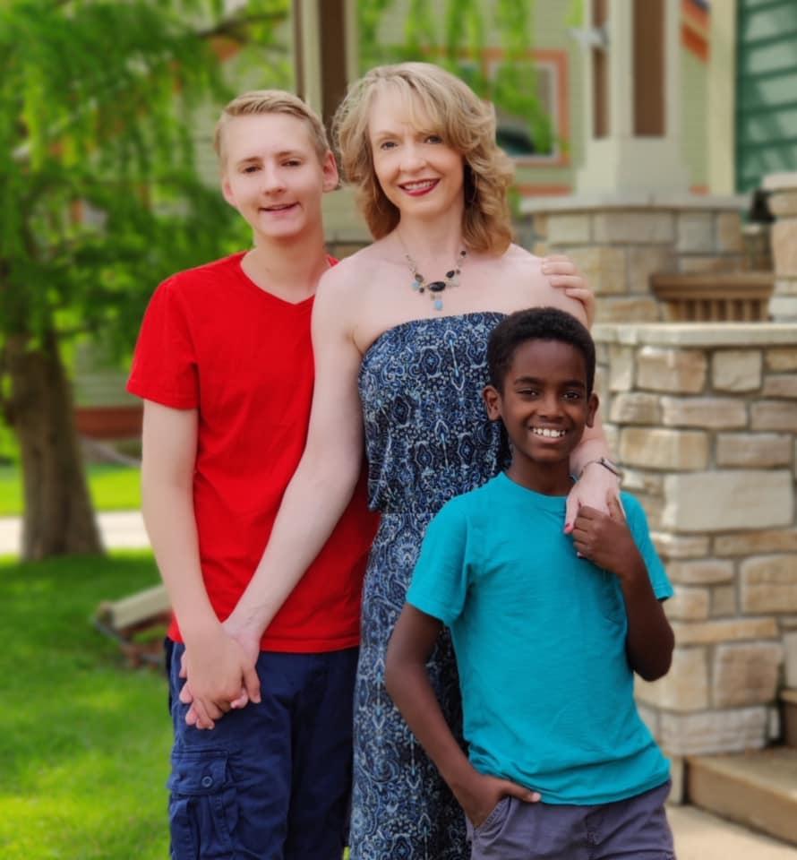 Larson with his adoptive mom and brother. (Courtesy of <a href="https://jonahhands.com/">Jonah’s Hands</a>)