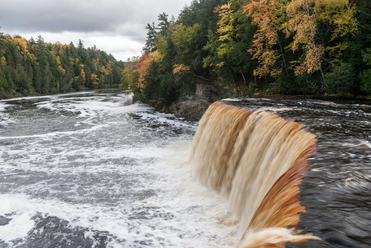 The unusual color of Tahquamenon Falls in Paradise, Michigan, is created by tannins leached from upstream cedar trees. (Courtesy of Baluzek/Dreamstime.com)