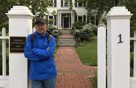 Chinese journalist Dong Yuyu in front of the Newman Foundation for Journalism in Harvard University, Cambridge, Massachusetts, in May 2017. (Dong family via AP)