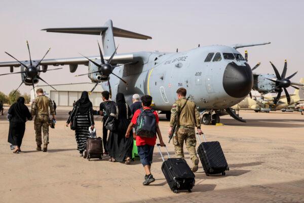 British nationals board an RAF aircraft in Khartoum, Sudan, on April 26, 2023. (UK Ministry of Defence via Getty Images)