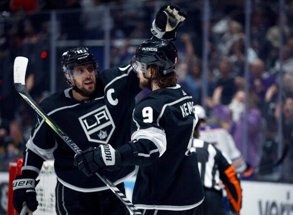 Anze Kopitar (11) and Adrian Kempe (9) of the Los Angeles Kings celebrate a goal against the Edmonton Oilers during the second period in Game Six of the First Round of the 2023 Stanley Cup Playoffs in Los Angeles Arena on April 29, 2023. (Ronald Martinez/Getty Images)