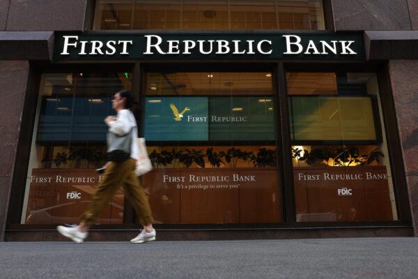 A pedestrian walks by a First Republic Bank in San Francisco, Calif., on April 26, 2023. (Justin Sullivan/Getty Images)