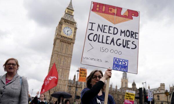 NHS workers take part in a march from St Thomas's Hospital to Trafalgar Square in London, on May 1, 2023. (Jordan Pettitt/PA Media)
