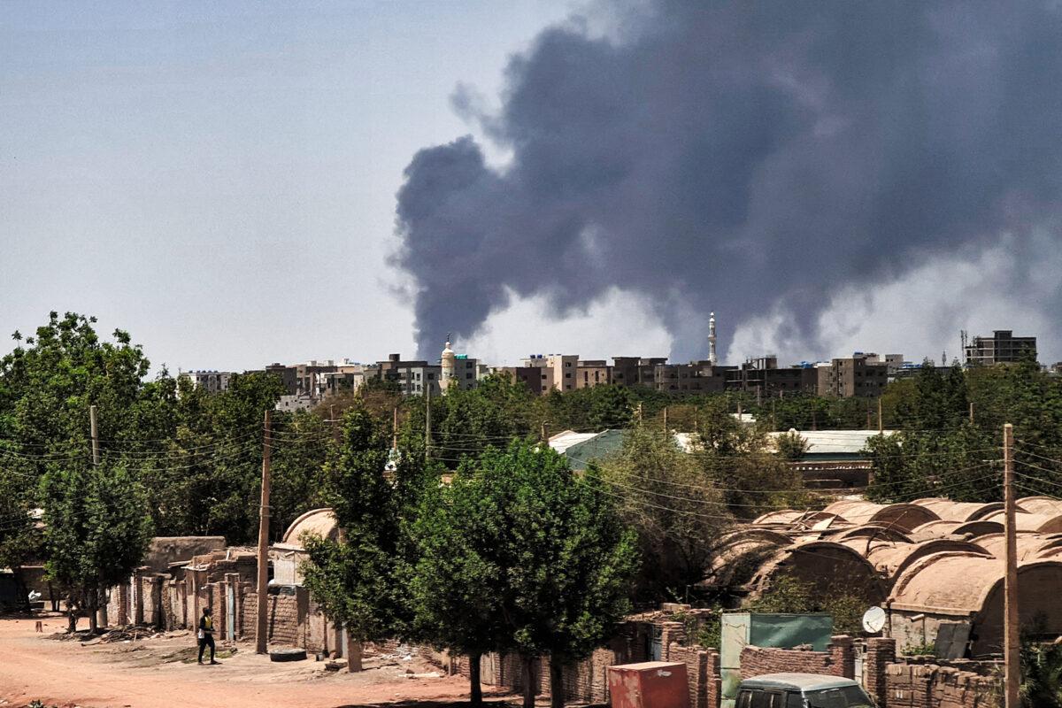 Smoke billows over buildings in Khartoum on May 1, 2023, as deadly clashes between rival generals' forces entered a third week. (AFP via Getty Images)