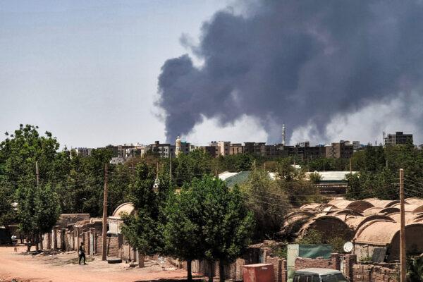 Smoke billows over buildings in Khartoum on May 1, 2023, as deadly clashes between rival generals' forces have entered their third week. (AFP via Getty Images)