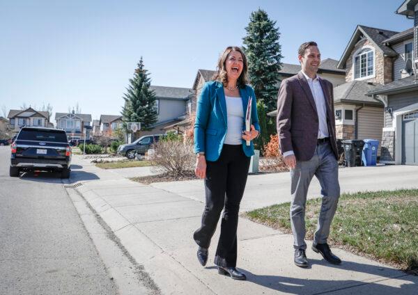 UCP Leader Danielle Smith (L) arrives to make an election campaign announcement in Calgary, Alta., on May 1, 2023. (The Canadian Press/Jeff McIntosh)