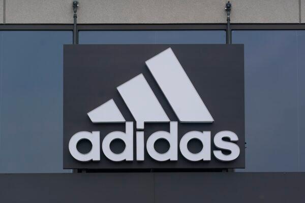 A sign is displayed in front of an Adidas retail store in Paramus, N.J., on Oct. 25, 2022. (Seth Wenig/AP Photo)