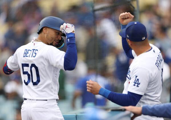 Mookie Betts (50) of the Los Angeles Dodgers celebrates his second homerun of the game with David Peralta (6) during the eighth inning at Dodger Stadium in Los Angeles on May 31, 2023. (Harry How/Getty Images)