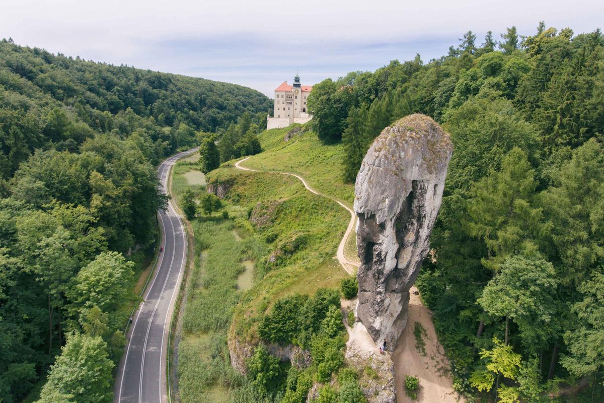 An aerial view of Pieskowa Skala castle with 98-foot-high limestone column “Bludgeon of Hercules” in the foreground in southern Poland. (Courtesy of <a href="https://www.instagram.com/foto_po_mojemu_m.kindryk/">Małgorzata Kindryk</a>)