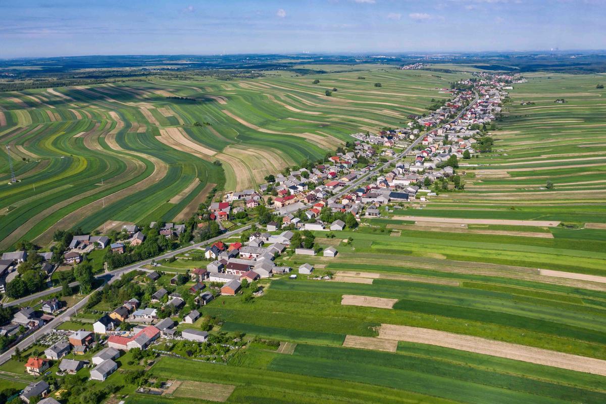 Sułoszowa and its photogenic ribbons of crop fields seen from far above the ground in southern Poland. (Chawranphoto/Shutterstock)