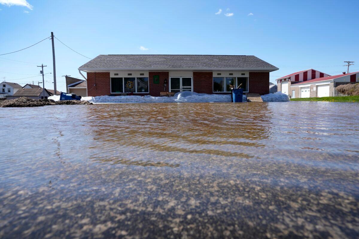 A business sits in floodwaters from the nearby Mississippi River, in Buffalo, Iowa, on May 1, 2023. (Charlie Neibergall/AP Photo)