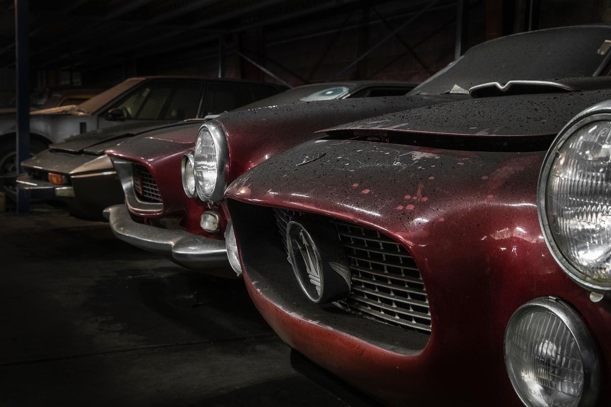 The grille and headlights of a cherry red Maserati 3500 GT 1958, with other classic cars in Ad Palmen's collection. (Courtesy of <a href="https://www.facebook.com/classiccarauctionsNL/">Classic Car Auctions</a>/<a href="https://www.classiccar-auctions.com/palmen">classiccar-auctions.com</a>)
