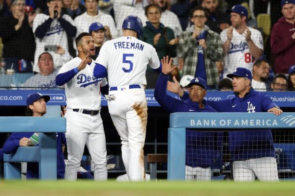 Freddie Freeman (5) of the Los Angeles Dodgers celebrates scoring in the fourth inning with David Peralta (6) against the Philadelphia Phillies at Dodger Stadium in Los Angeles on May 1, 2023. (Katelyn Mulcahy/Getty Images)