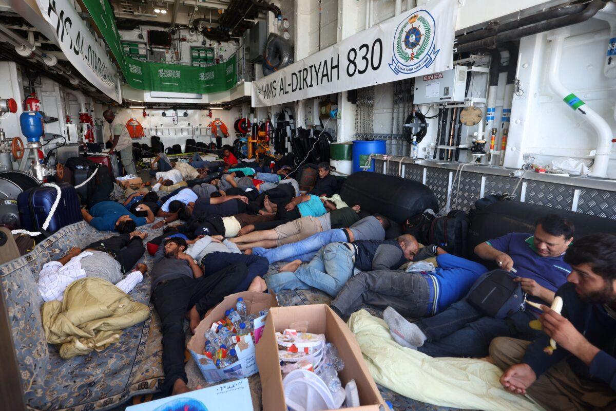 Evacuees rest onboard a Saudi vessel as it travels from Port Sudan to Jeddah on April 30, 2023. (Fayez Nureldine/AFP via Getty Images)