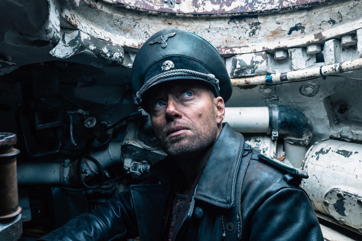 Nazi Obersturmführer Helldorf (Aksel Hennie) suspects the banging noise he hears outside his tank is his worst nightmare, in "Sisu." (Stage 6 Films)