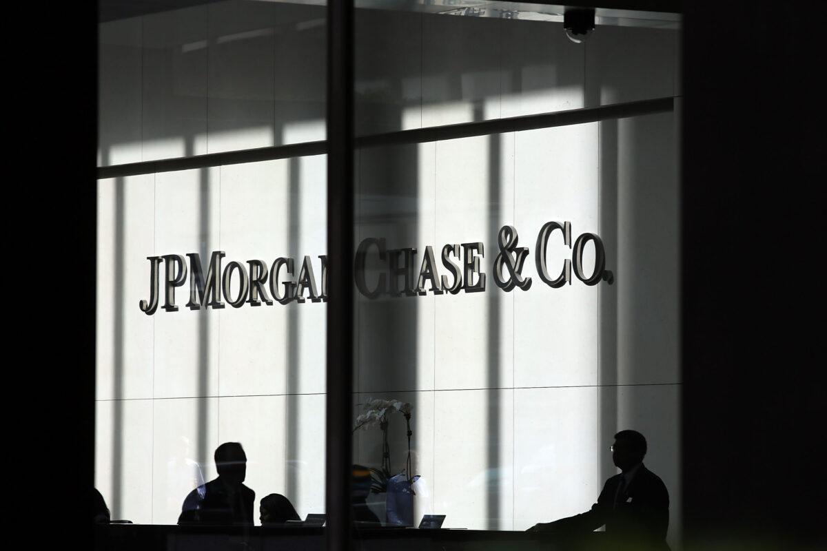 <br/>People pass a sign for JPMorgan Chase at it's headquarters in Manhattan in this file photo. (Spencer Platt/Getty Images)