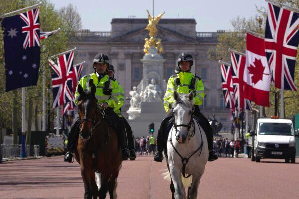 Police officers patrol at the Buckingham Palace ahead of the coronation of Britain's King Charles III in London on April 29, 2023. (Kin Cheung/AP Photo)