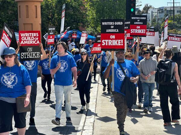 Members of the Writers Guild of America's West Coast and East Coast branches set up picketing line in front of the Walt Disney Co.'s corporate headquarters in Burbank, Calif., on May 2, 2023. (Jill McLaughlin/The Epoch Times)