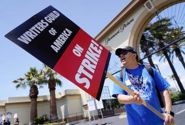 Ray Utarnachitt, a captain in the Writers Guild of America West, pickets with others at an entrance to Paramount Pictures in Los Angeles, on May 2, 2023. (Chris Pizzello/AP Photo)