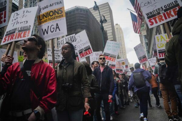 Striking writers march and picket calling for better wages outside Peacock NewFronts in New York, on May 2, 2023. (Bebeto Matthews/AP Photo)
