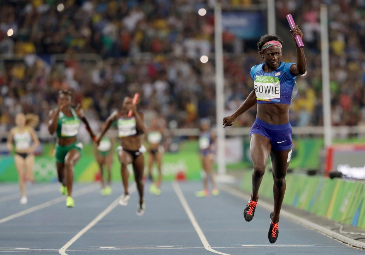 United States's Tori Bowie crosses the line to win the gold medal in the women's 4x100-meter relay final during the athletics competitions of the 2016 Summer Olympics at the Olympic stadium in Rio de Janeiro on Aug. 19, 2016. (David J. Phillip/AP Photo)