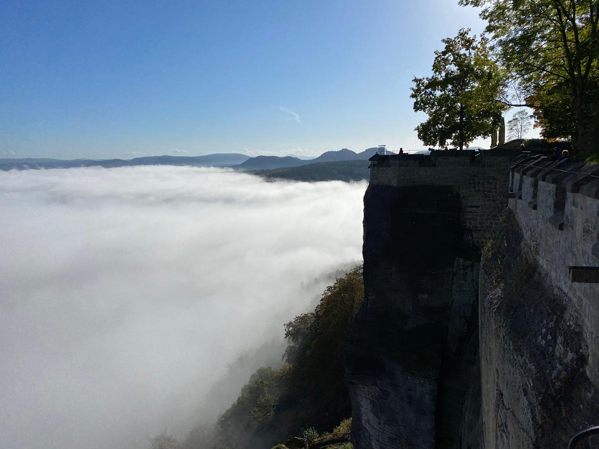 Visitors overlook a sea of fog at Königstein Fortress, near Dresden, Germany. (Tim Johnson)(Tim Johnson)