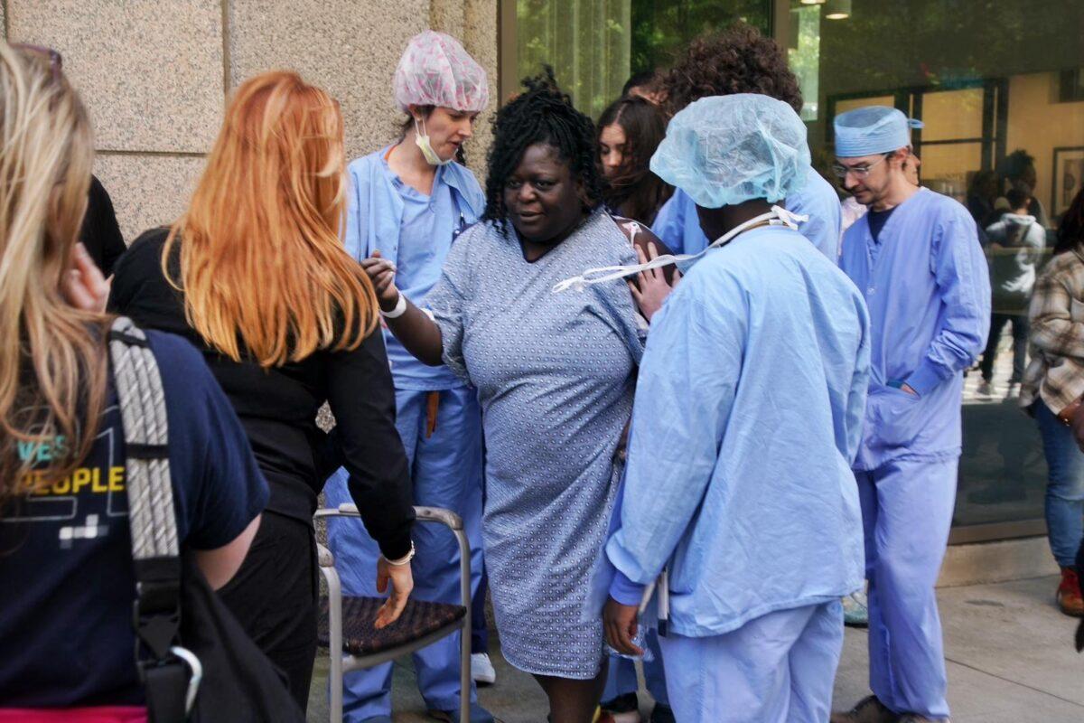 A patient is evacuated from a hospital after a man shot people in a building in Atlanta on May 3, 2023. (Elijah Nouvelage/AFP via Getty Images)