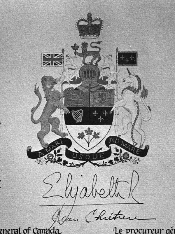 Queen Elizabeth IIs signature shows below the Canadian coat of arms and below that is the signature of former Attorney General Jean Chretien. These names are at the top centre of a proclamation giving Canada independence from Britain in Ottawa, Ont. April 17, 1982. (CP PHOTO/Andy Clark)
