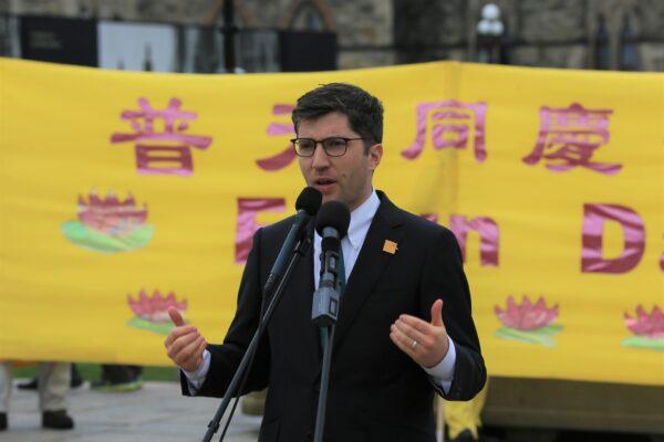 Conservative MP Garnett Genuis speaks at a rally to celebrate World Falun Dafa Day on Parliament Hill in Ottawa on May 3, 2023. (Jonathan Ren/The Epoch Times)