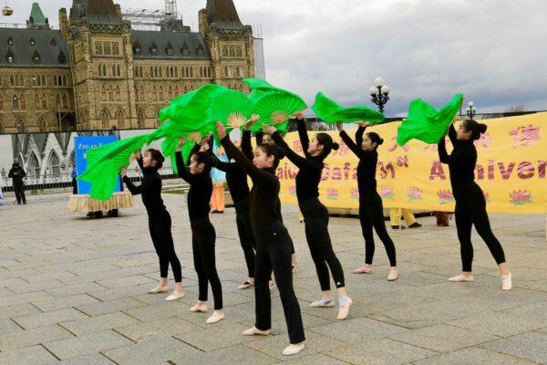 Falun Dafa adherents present a traditional Chinese dance performance to celebrate World Falun Dafa Day on Parliament Hill in Ottawa on May 3, 2023. (Jonathan Ren/The Epoch Times)