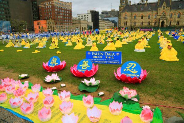 Falun Dafa adherents hold an event to celebrate World Falun Dafa Day on Parliament Hill in Ottawa on May 3, 2023. (Jonathan Ren/The Epoch Times)