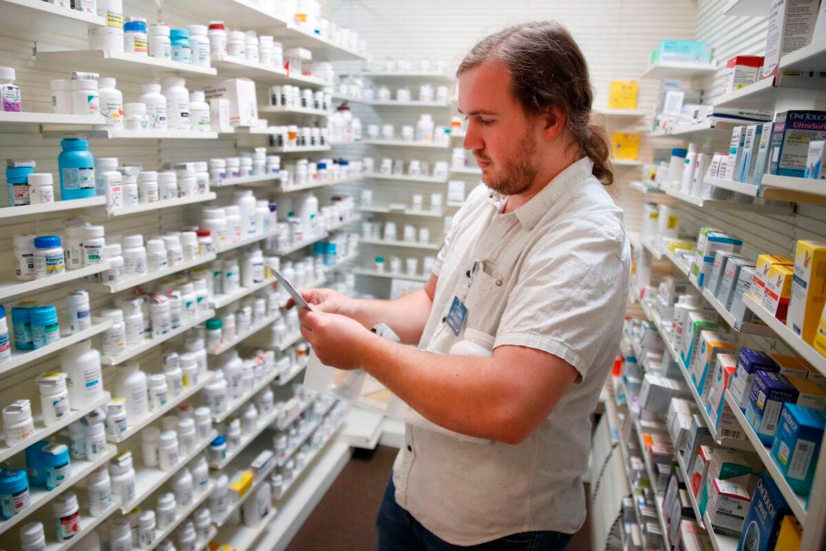 A pharmacy staff member fills prescriptions at Rock Canyon Pharmacy in Provo, Utah, on May 20, 2020. (George Frey/AFP via Getty Images)