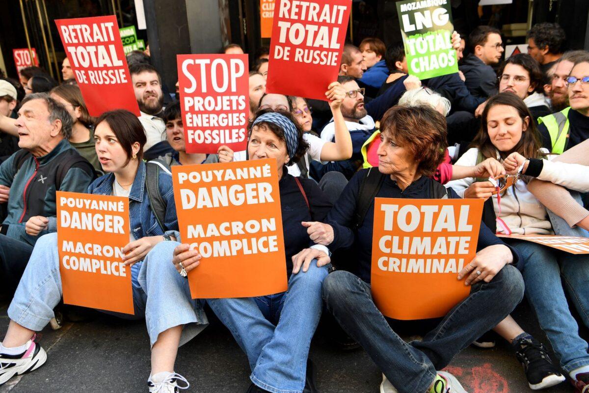 Climate activists block access to the Salle Pleyel concert hall where a scheduled shareholder meeting of French energy giant TotalEnergies was to be held in Paris on May 25, 2022. The demonstrators are from several associations, including Greenpeace. (Bertrand Guay/AFP via Getty Images)